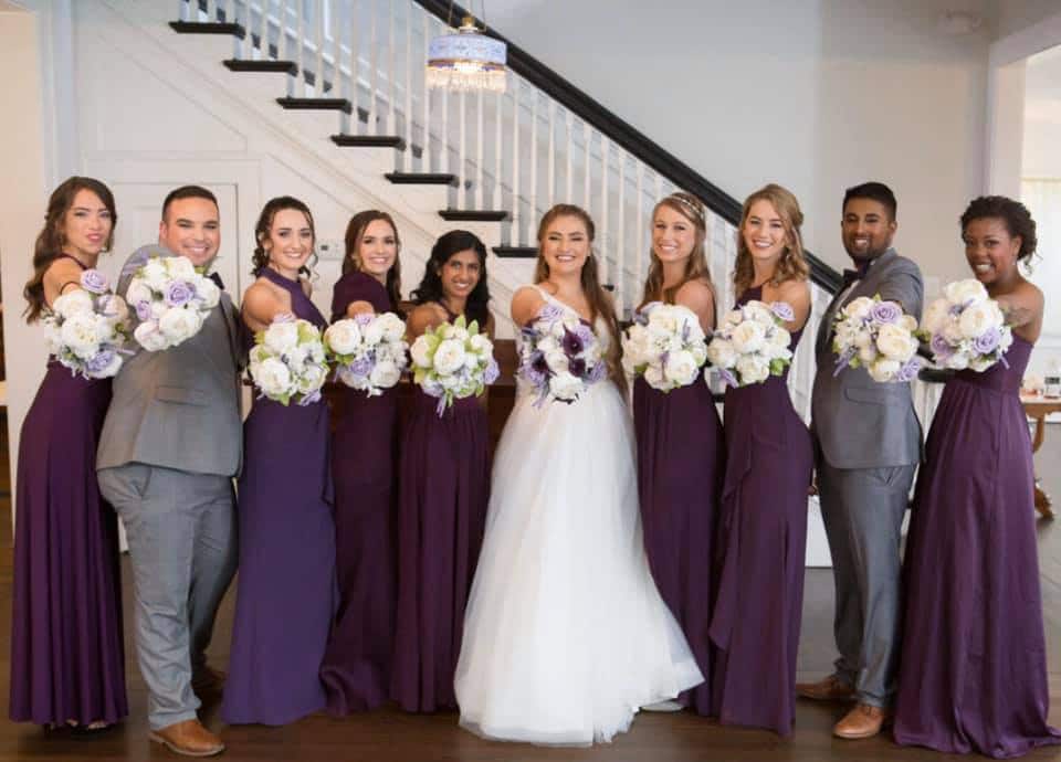 bride with bridesmaids and brides men in shades of purple and grey