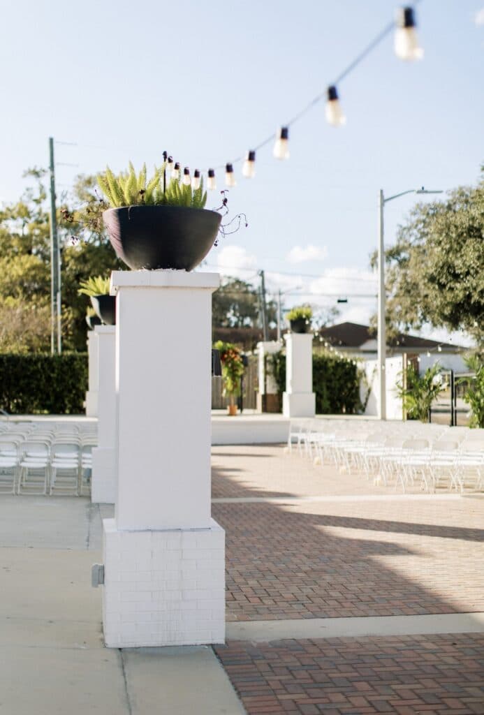 white pillars and market lights in outdoor space