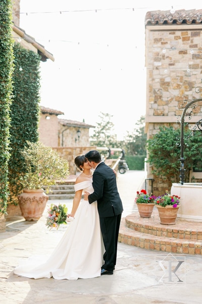 Bride and groom kissing at the Bella Collina