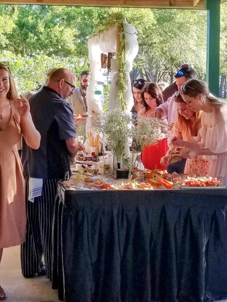 People helping themselves to a buffet reception