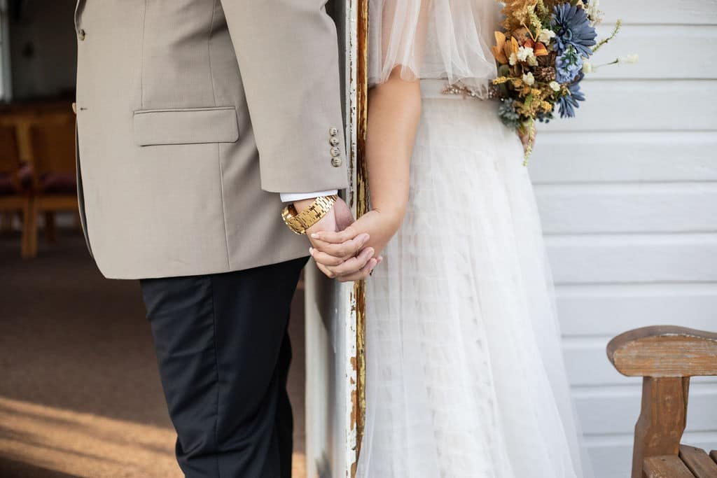 first touch at winter boho wedding at Camp Ithiel