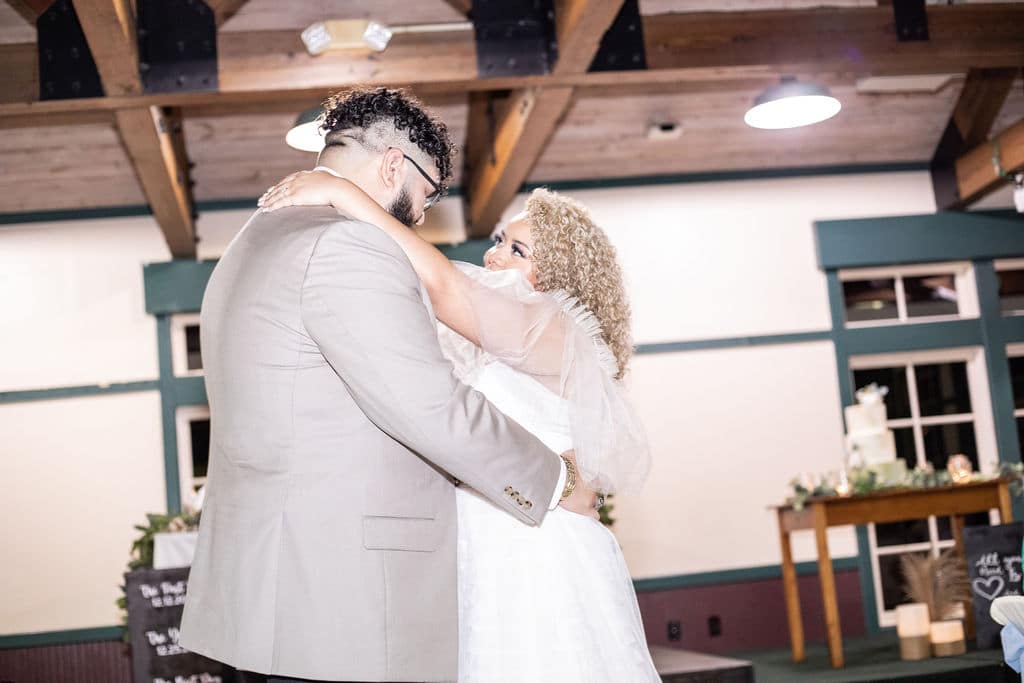 bride and groom first dance at their winter boho wedding at Camp Ithiel