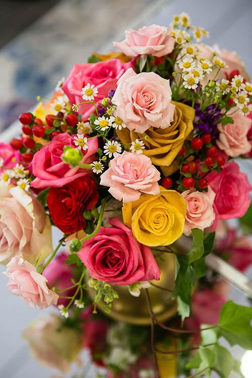 beautiful wedding bouquet with bright pinks, soft pins and mustard colored flowers by Leaf & Blossom Co.