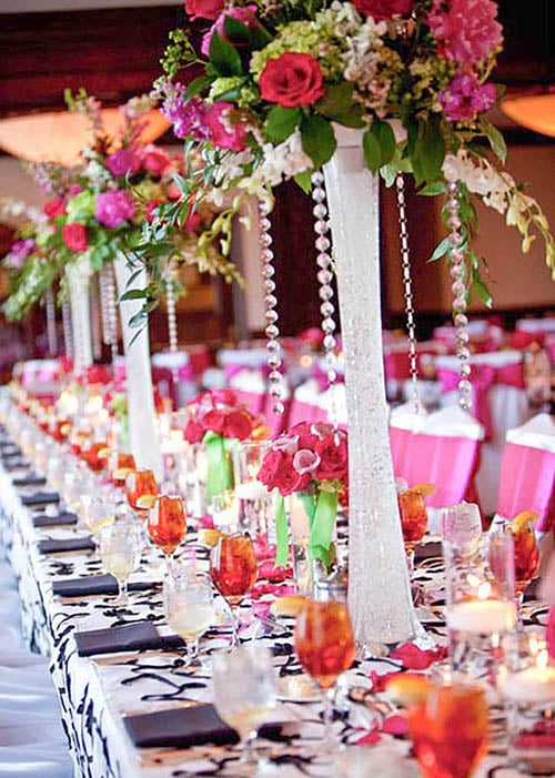 wedding reception table with tall centerpieces by Leaf & Blossom Co
