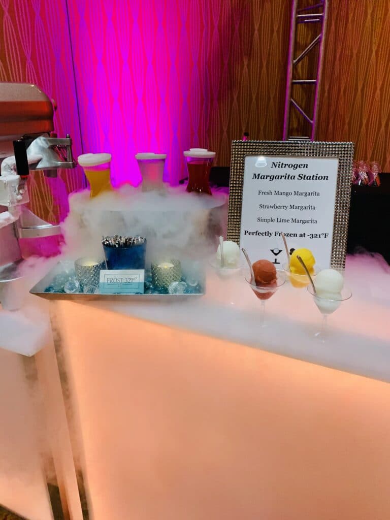 pink and orange lit bar with frosted offerings by Frost 321