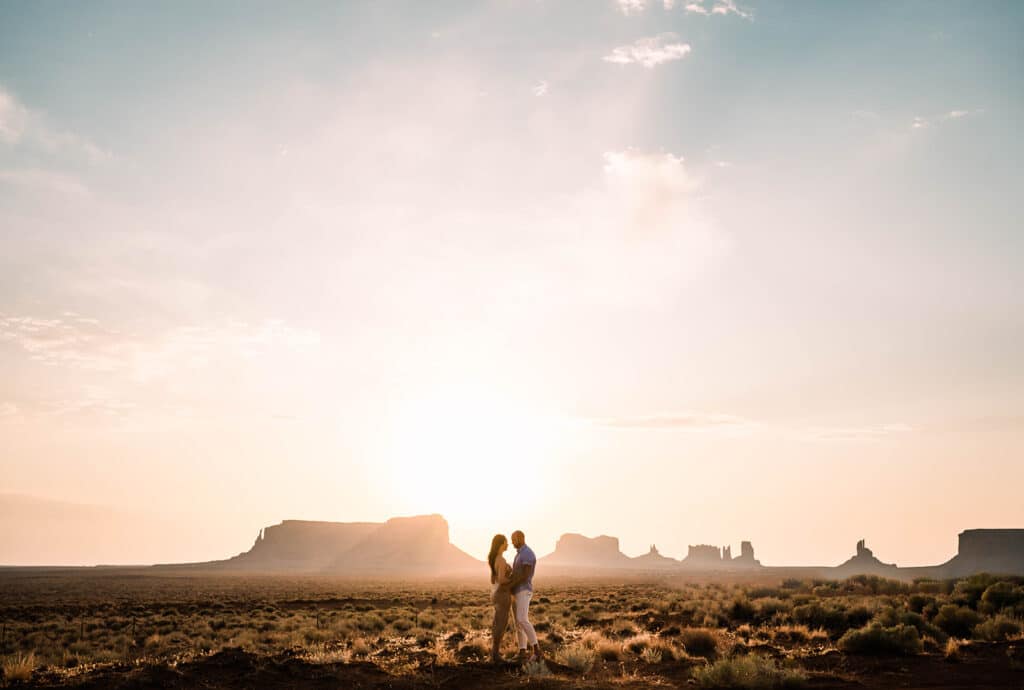 couple against desert silhouette by Roy Serafin Photo Company