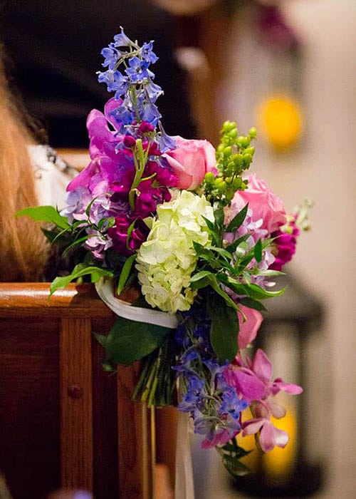 aisle flowers in pinks and purples by Leaf & Blossom Co