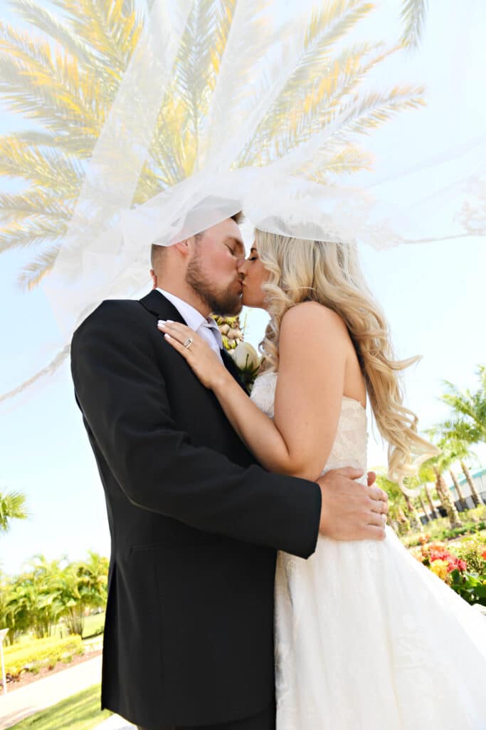 2 rhodes studios photography and video39f24f35ed306bc39bb49f7fd4444810 - Rhodes Studios bride and groom kissing under a veil by Rhodes Studios, Photography and Video, Orlando, FL