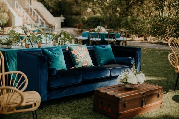 aquamarine coach with wooden accents in outdoor reception by A Chair Affair Inc.