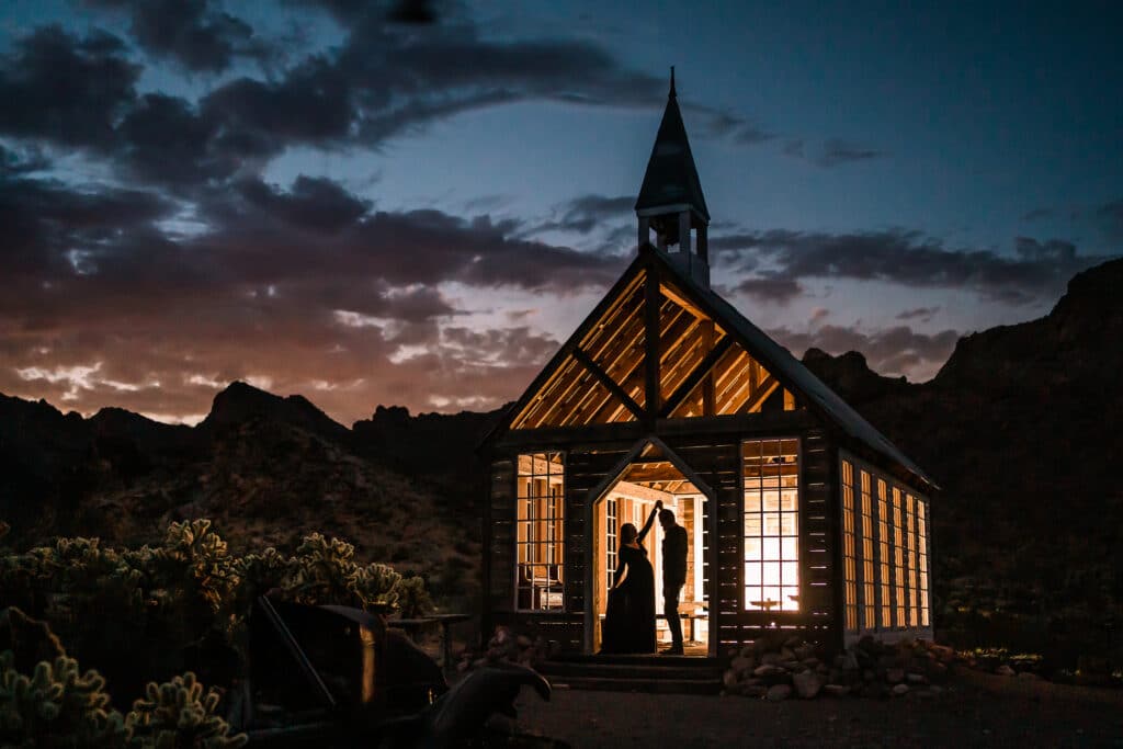 chapel lit up against a stunning sunset sky by Roy Serafin Photo Company