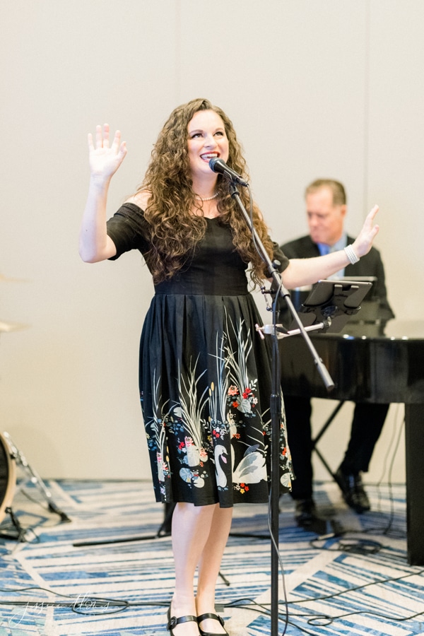 Woman singing at a reception