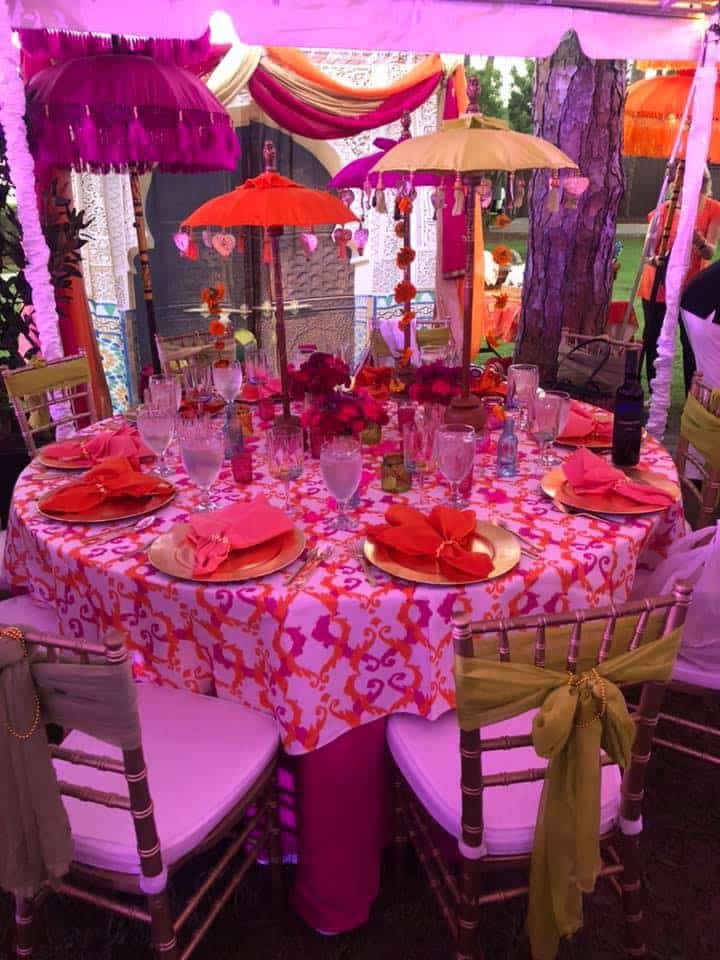 umbrella themed tables draped in pink and orange from Dawn Gilmore Productions