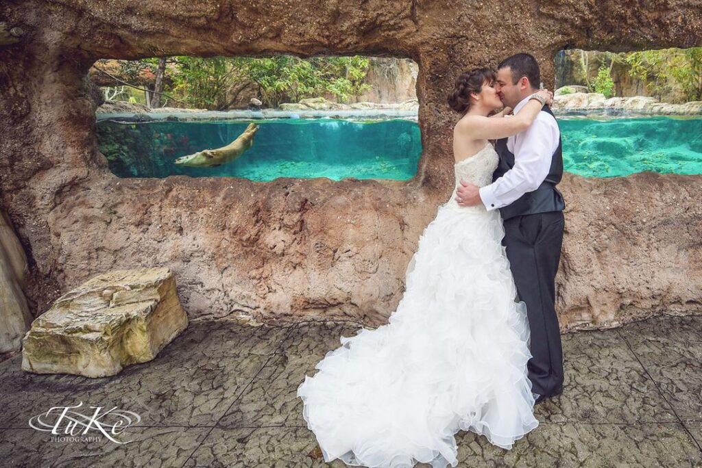 bride and groom kissing in the grotto of the Central Florida Zoo & Botanical Gardens