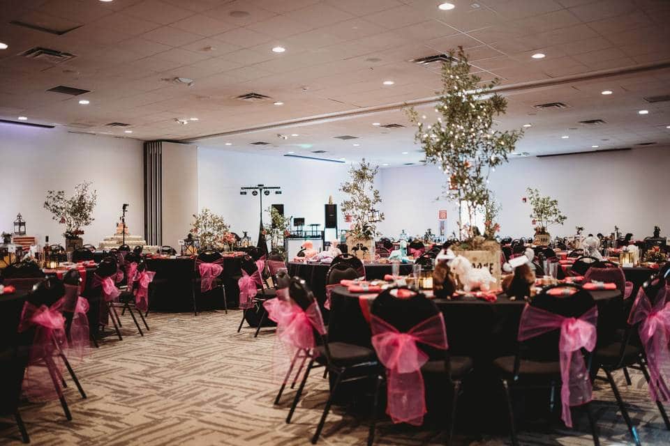 wedding reception room with pink and burgundy accents at the Central Florida Zoo & Botanical Gardens