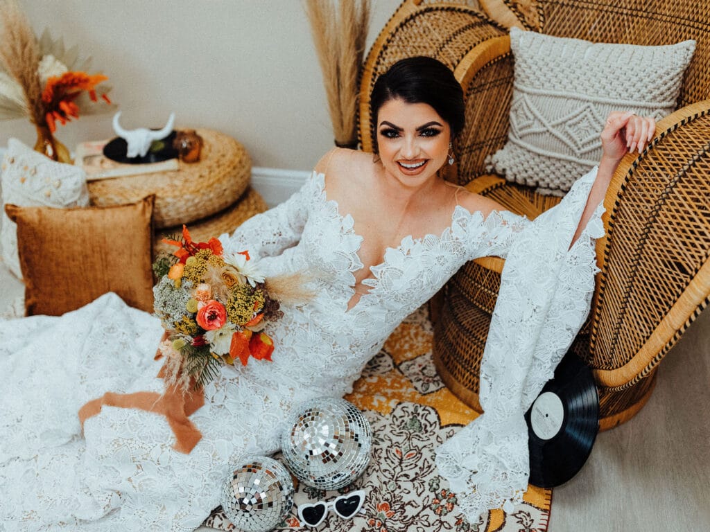 bride lounging with assorted accessories at Theory Bridal House