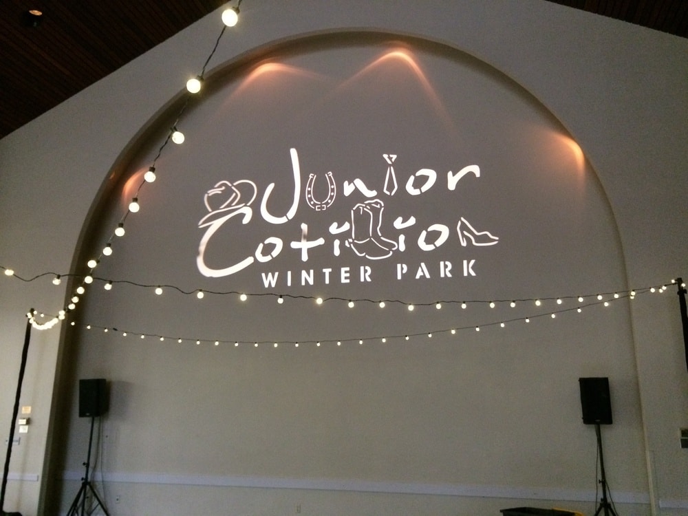 lit up logo on the wall for Junior Cotillion of Winter Park by Meisner Productions
