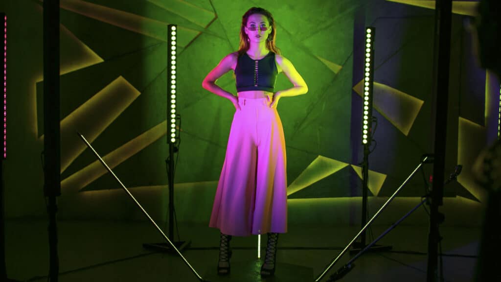 girl in pink skirt against green backdrop