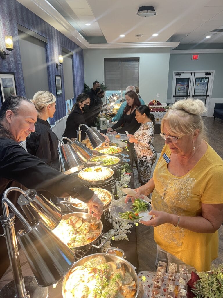 guests lining up to enjoy a meal by Corwin's Personal Chef and Catering Services