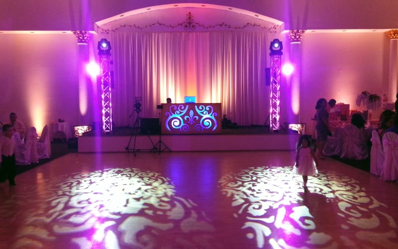 wedding reception room with lighted designs on floor from Dawn Gilmore Productions