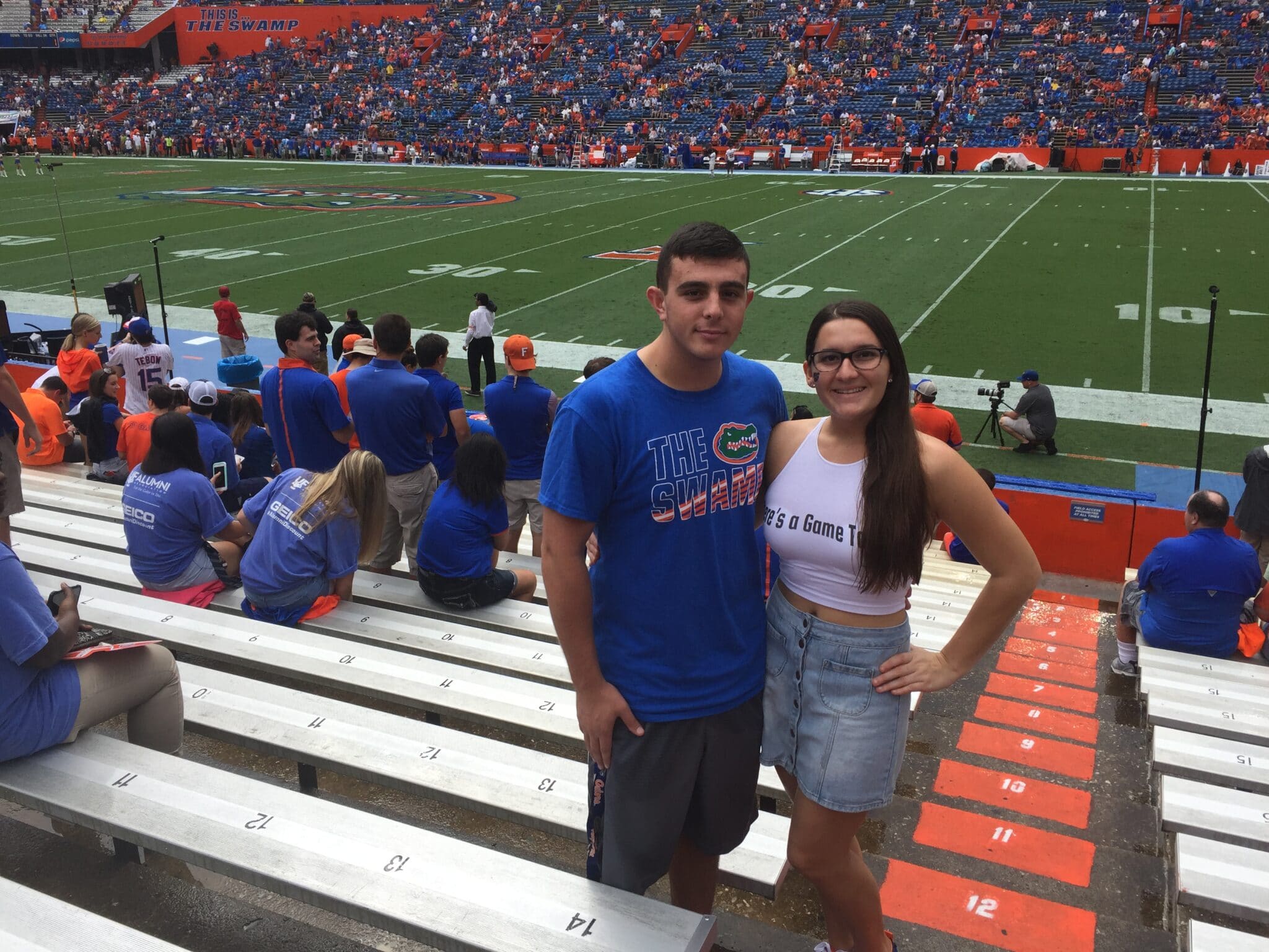 couple posing in The Swamp at U of F football game