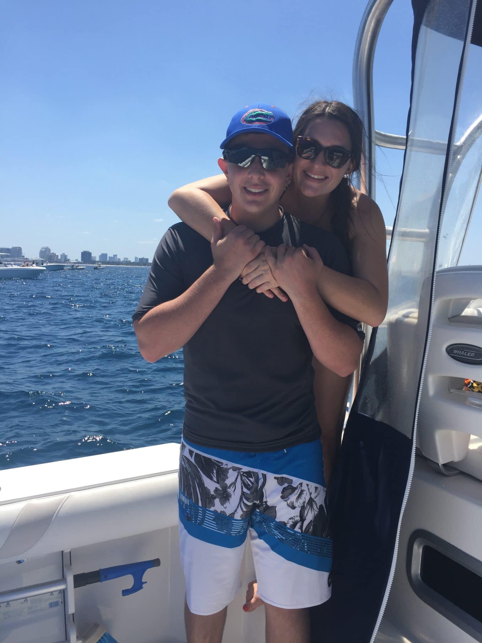 couple smiling and hugging on a boat in Florida
