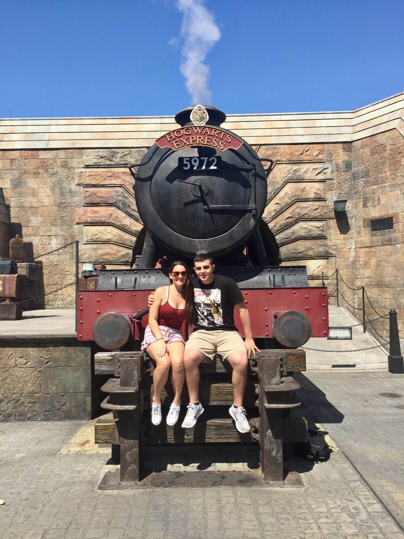 couple sitting on Hogwarts Express at Universal Studios