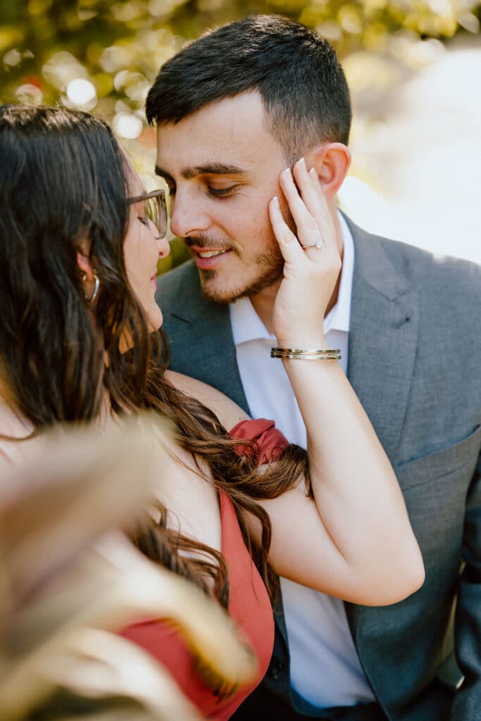 couple hugging after proposal at Leu Gardens