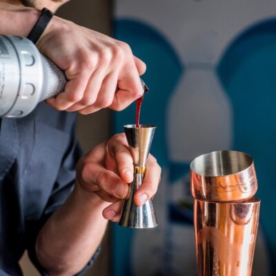 bartender pouring into jigger from My Bar Service