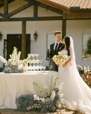 bride and groom at champagne tower poured by My Bar Service