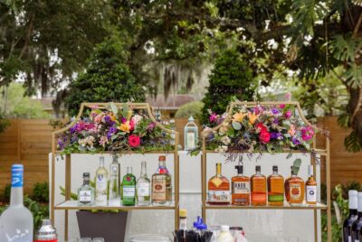 bar setup with colorful flowers by My Bar Service