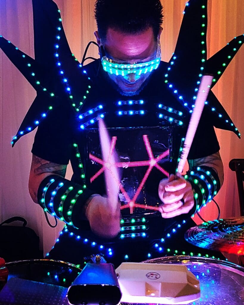 drummer in a lit up suit by Kenny Kings Music