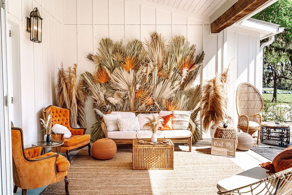 pumpkin colored chairs and pampas grass accents by Making It Matthews