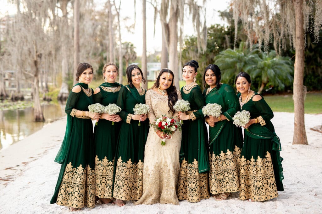 bride and her bridesmaids in green with lavish gold embellished dresses by Sydney Morman Photography