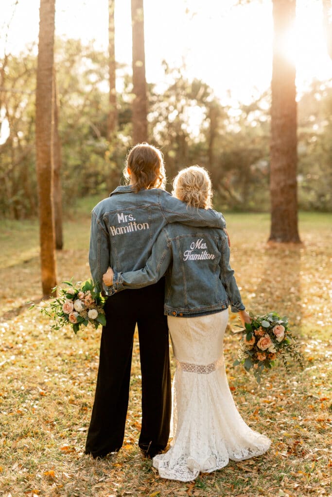 brides wearing their Mrs. jackets by Sydney Morman Photography