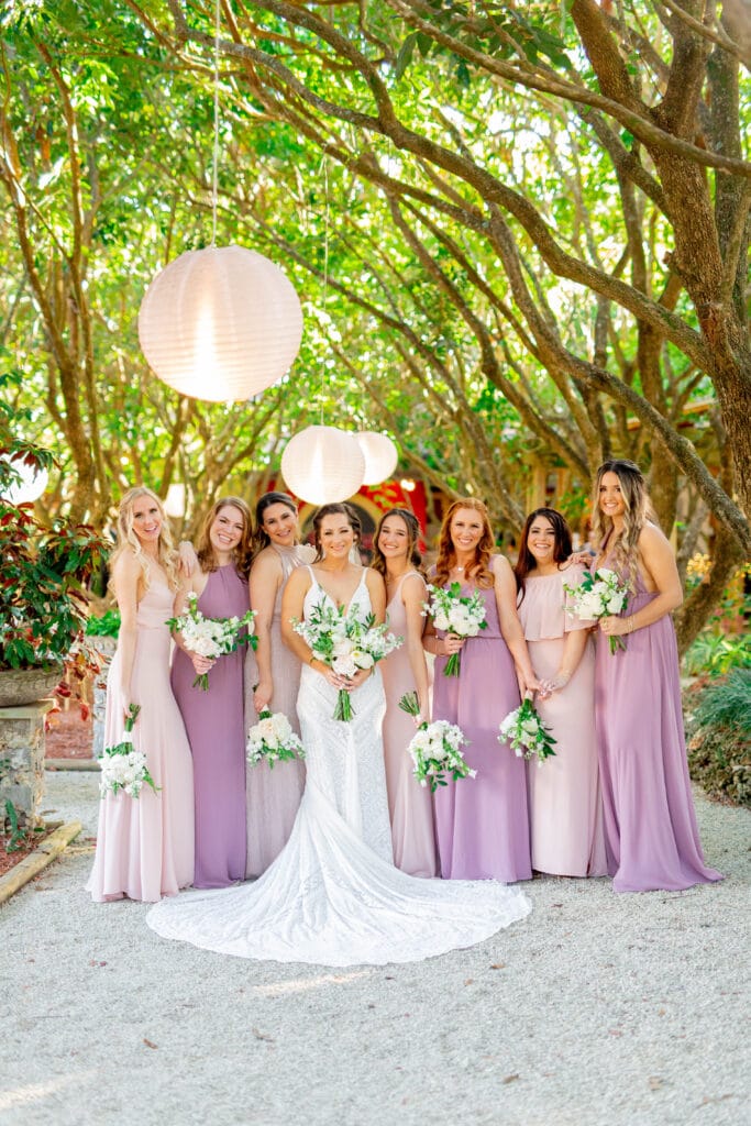 bridesmaids in shades of lilac and lavender with bride by Sydney Morman Photography