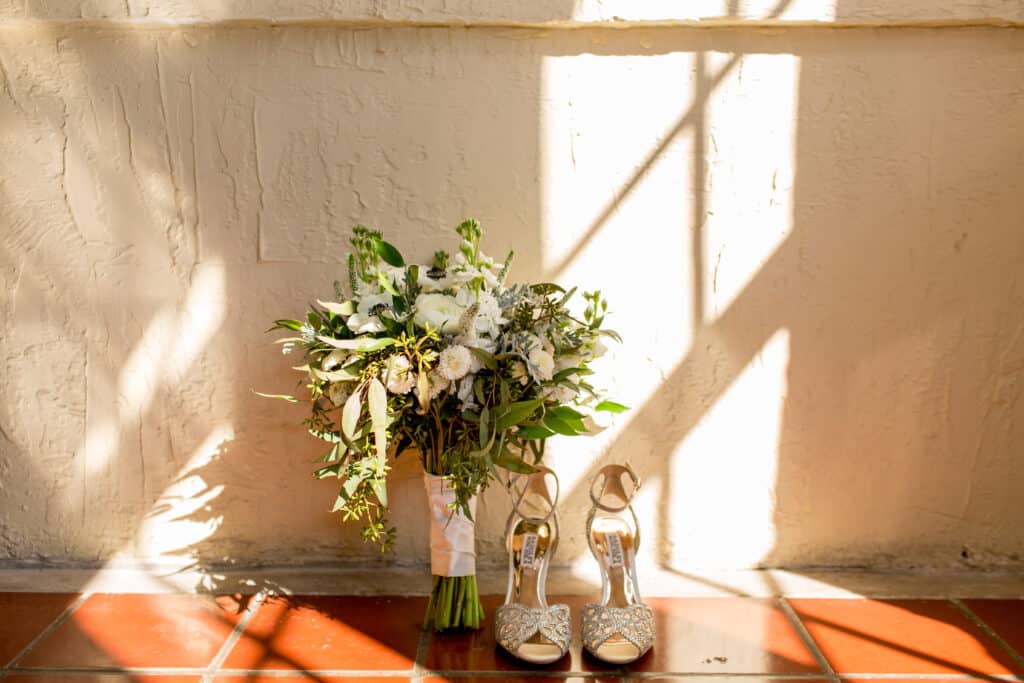 photo of bridal bouquet and wedding shoes by Sydney Morman Photography