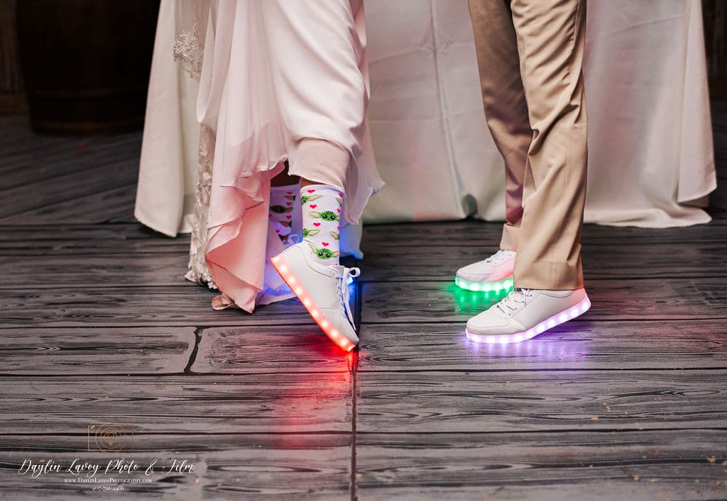 colorful lighted sneakers on a wedding dance floor coordinated by SMS Events & Design