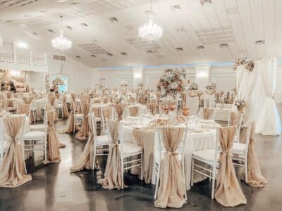 wedding reception room done in white with gold accents by Making It Matthews
