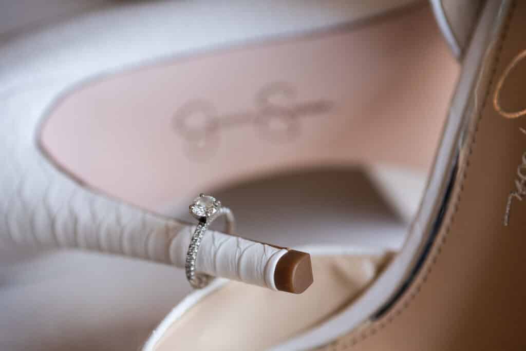 wedding ring on stiletto of wedding pumps, photo from Weddings By Ray