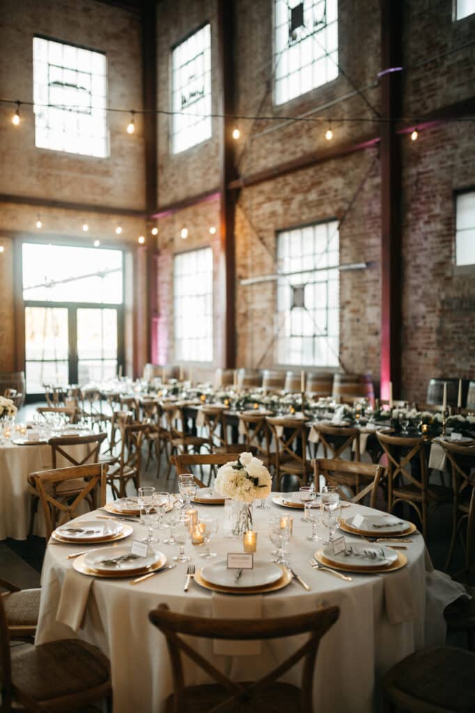 wedding reception room in tall brick building photo by Allie & Joey