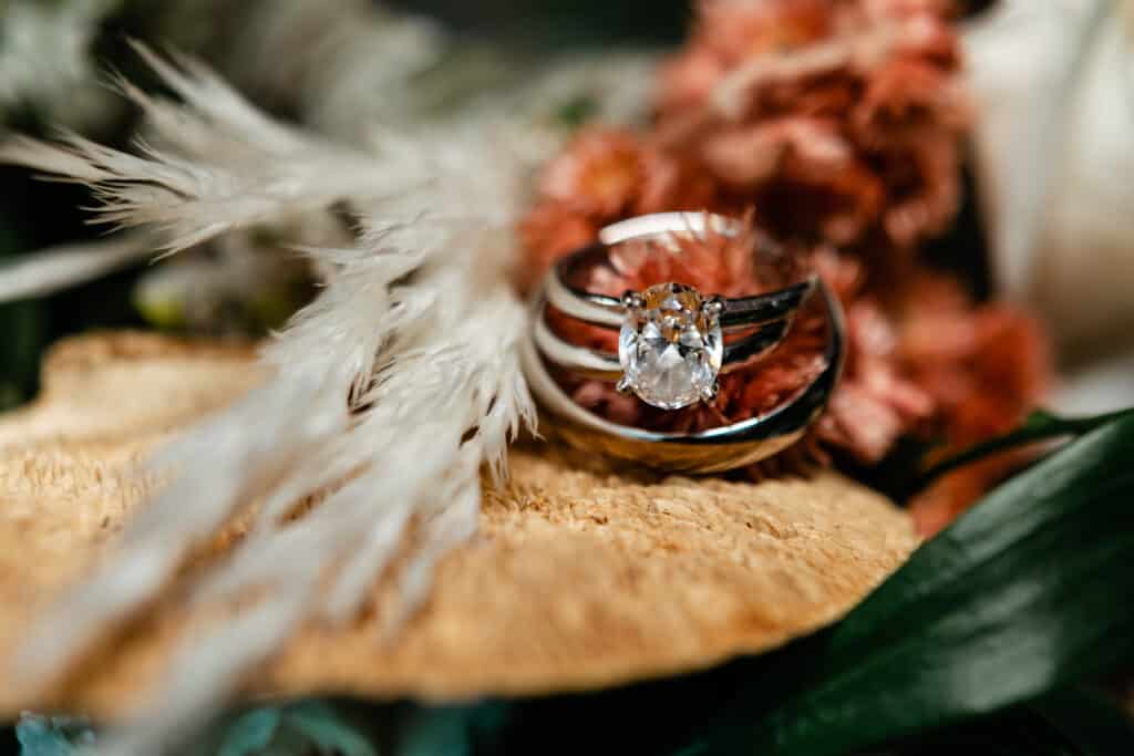 Close up of an oval ring and flowers