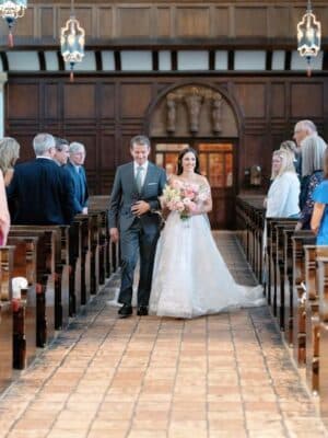 Bride and father of the bride walking down the aisle for her ceremony