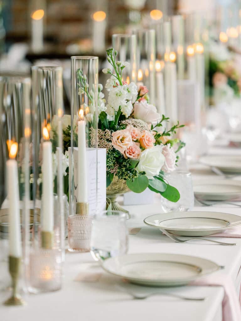 long table with candles and pink, white and gold accents