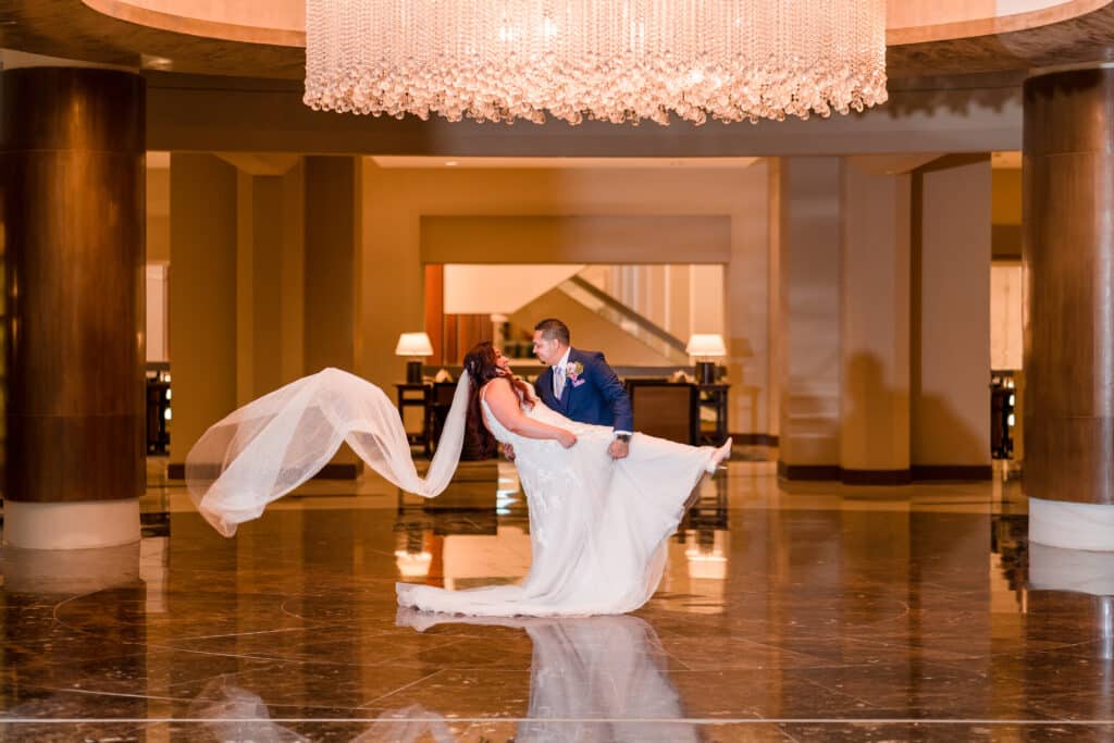 groom dipping bride on an empty dance floor photo by Jerzy Nieves Photography LLC