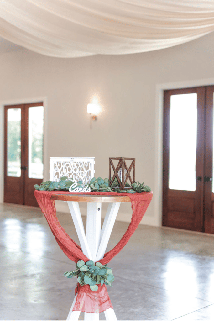 tall guest sign-in table in room with white draped ceiling at The Carriage House at Vedder Farms