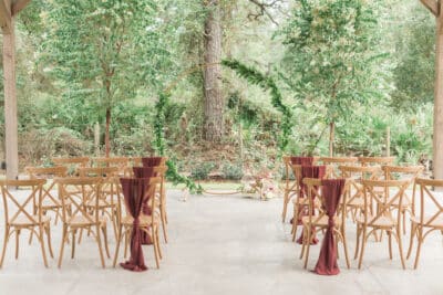 Wooden chairs in front of an oak set up for a reception