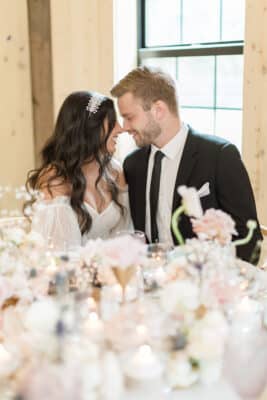bride and groom having a private moment at the reception at The Barn at Hidden Oaks Farm of Lake Mary