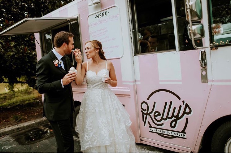 bride and groom celebrating in front of Kelly’s Homemade Ice Cream truck