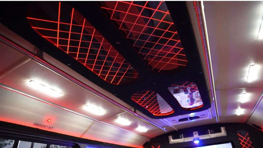 ceiling lights in red and black in the Hidden Secrets Luxury Party Bus