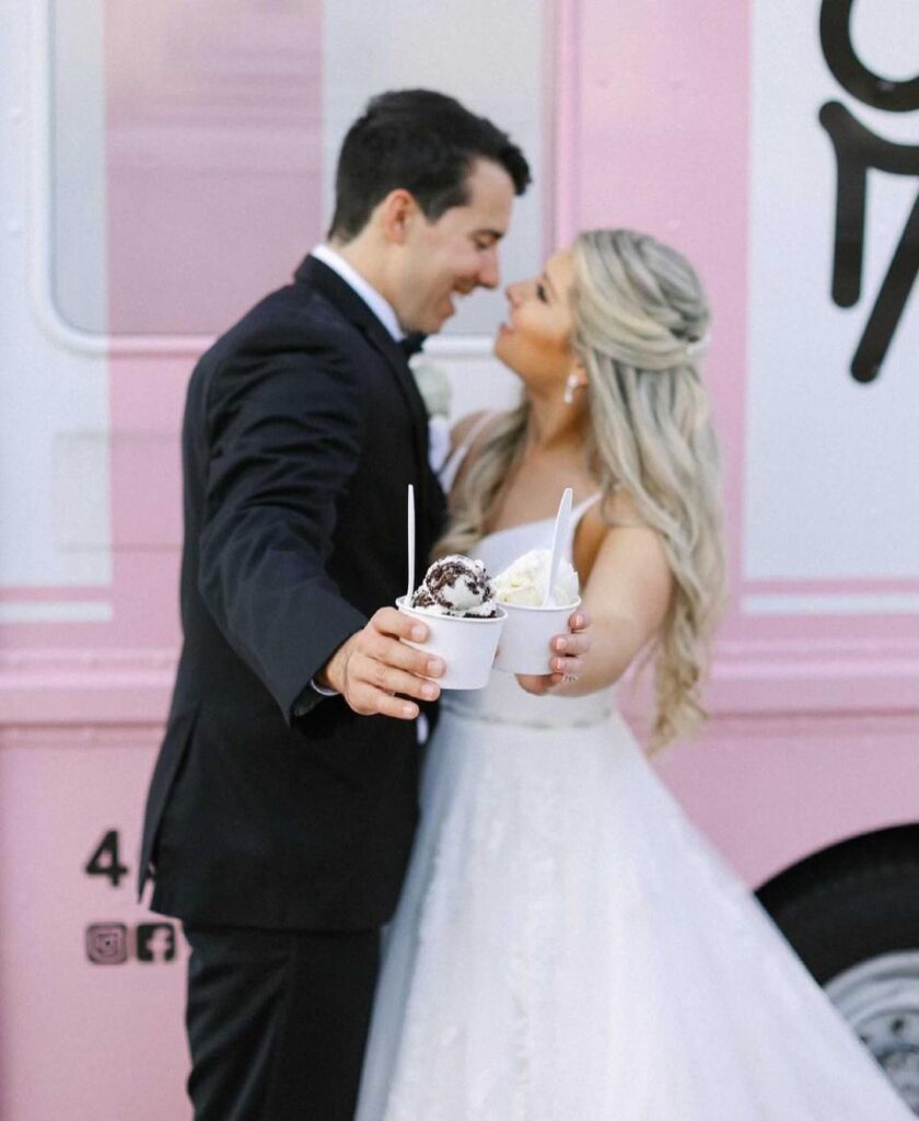 bride and groom toasting with ice cream cups by Kelly’s Homemade Ice Cream truck